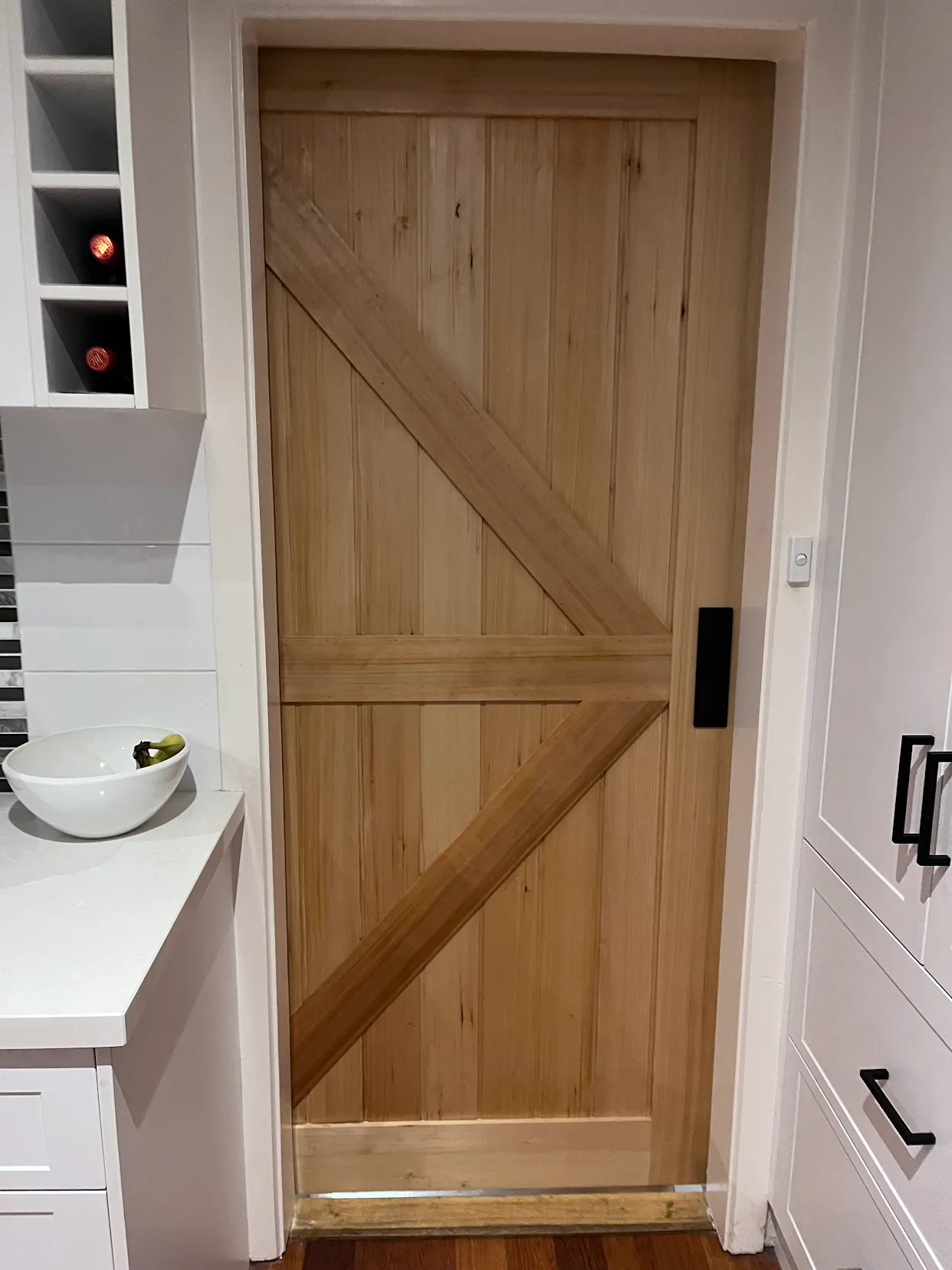 Custom timber barn door in a kitchen