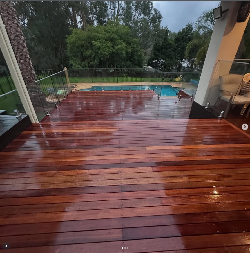 Elevated hardwood deck overlooking a pool