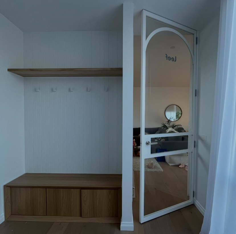 Custom entryway fit-out with built-in bench and shelving
